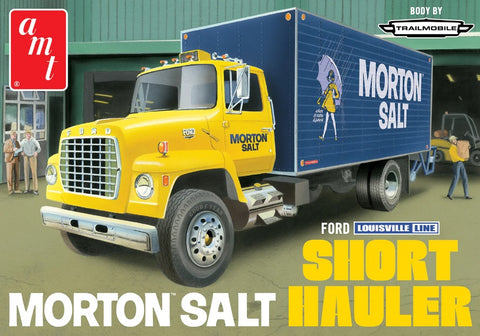Pictured: A yellow Ford Short Hauler truck with Blue box featuring Morton Salt and girl in yellow dress with umbrella. Box art for AMT model kit of Ford Short Hauler featuring Morton Salt.  