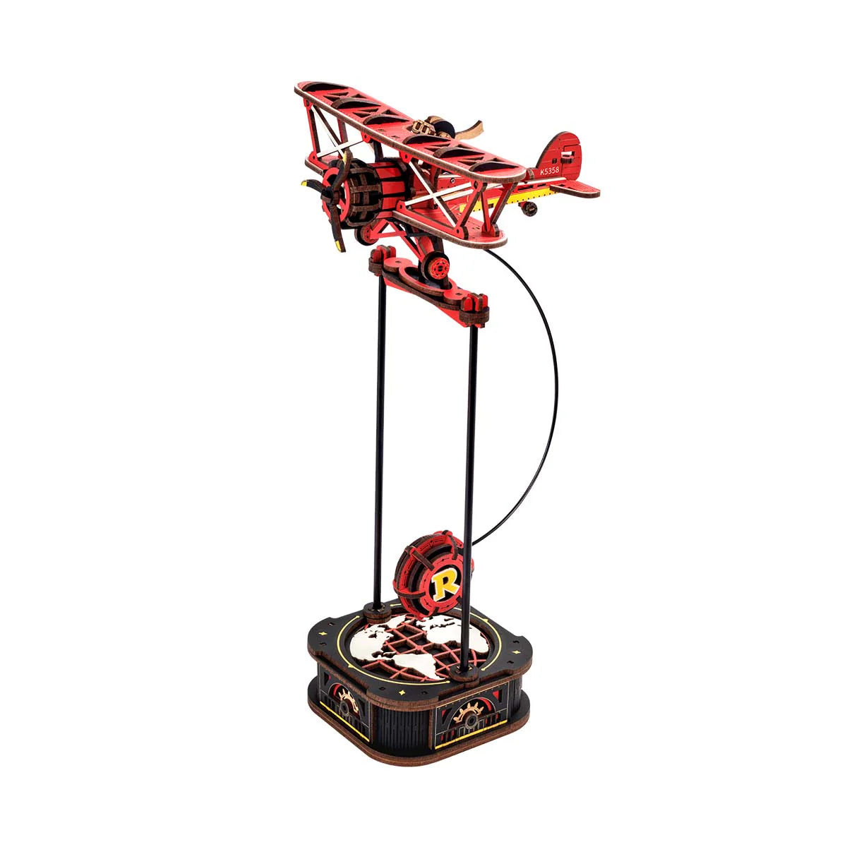 Red plane pendulum toy made of laser cut wood.