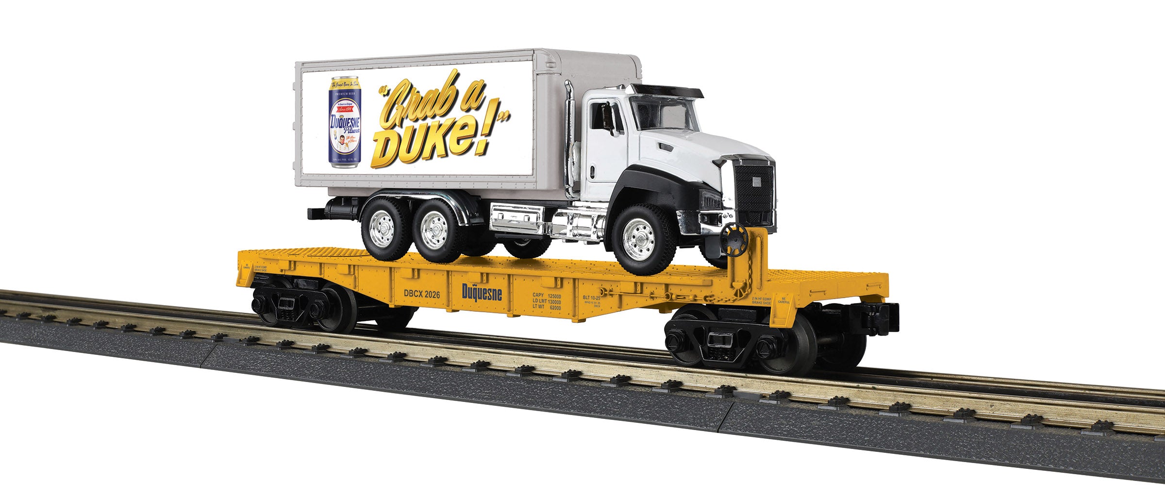 Model train flat car with box truck load.  Truck has a picture of a can and "Grab a DUKE" printed on the side.