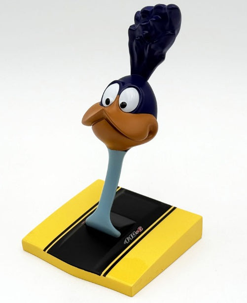 Road runner head sticking out of a car hood.