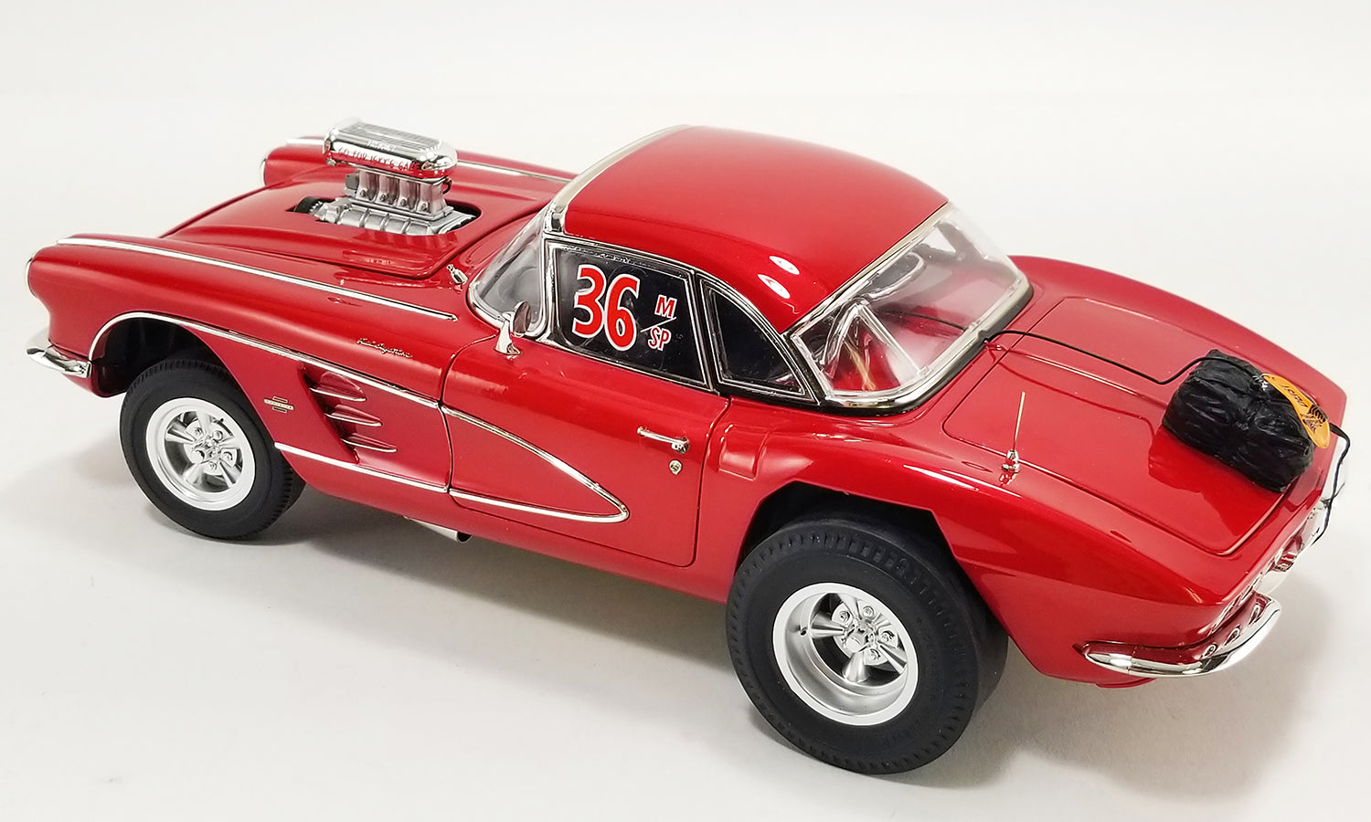 1/18 scale model of a red 1961 Chevrolet Corvette Gasser with the number 36 and 'Original Mazmanian' text on the side.