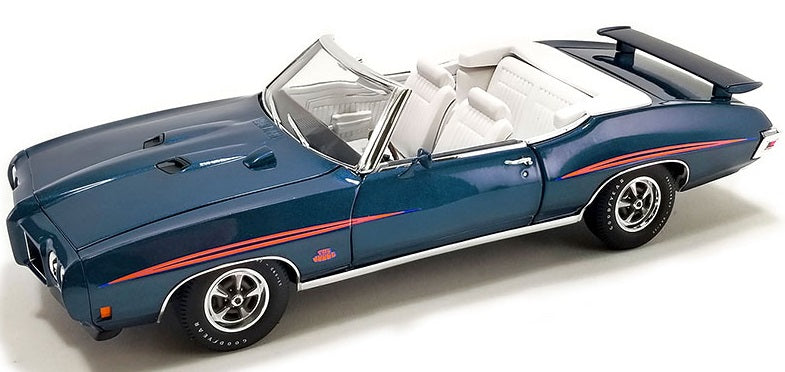 Side view of blue Pontiac GTO with open convertible roof.