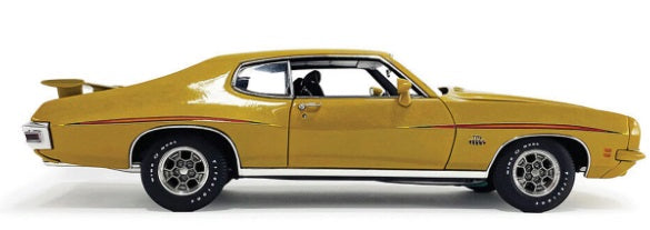 Side view of gold colored car.