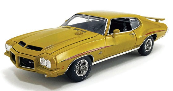 Front and side view of gold colored car.