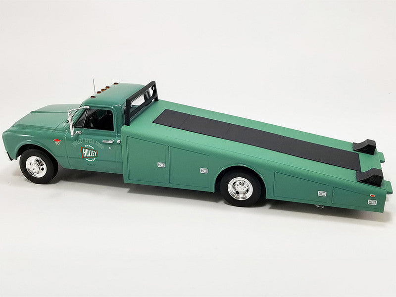 1/18 scale model of a Chevrolet ramp truck in green with "Holley Speed Shop" graphic on the doors.