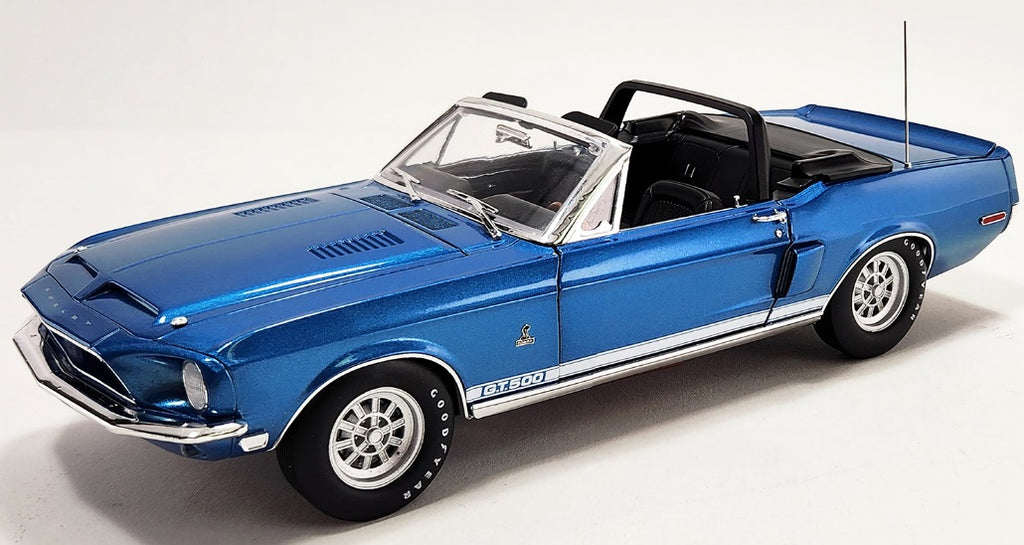 Diecast model car of a blue 1968 Shelby GT500 Convertible.