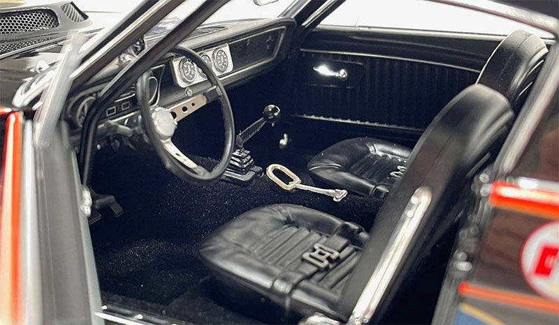 Close up of the interior of a diecast model car.