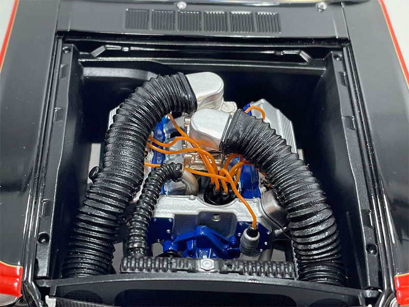 Close up of the engine on a diecast model car.