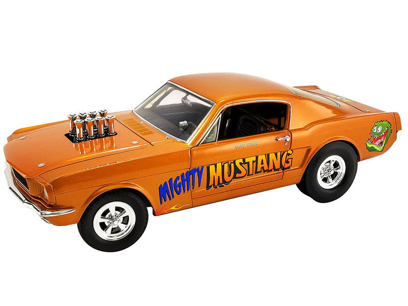 1/18 scale diecast 1965 Ford Mustang in orange with "Mighty Mustang" lettering on the side and "Rat Fink" graphic.
