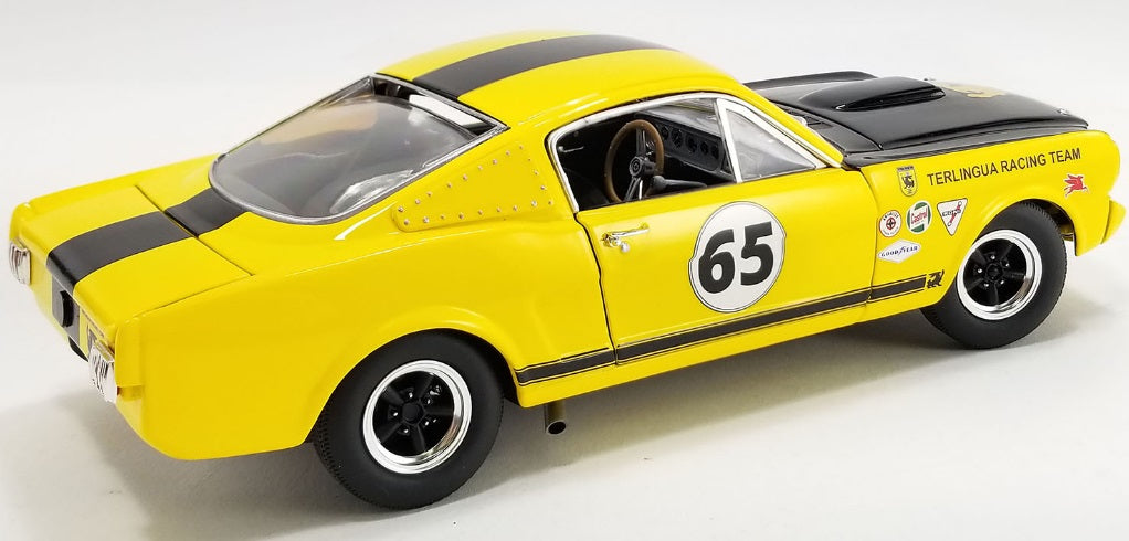 A 1/18 scale model of a 1965 Shelby GT350R "Terlingua Racing Team" in yellow and black.