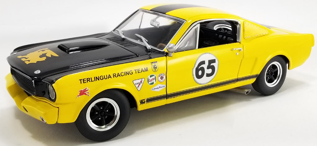 A 1/18 scale model of a 1965 Shelby GT350R "Terlingua Racing Team" in yellow and black.
