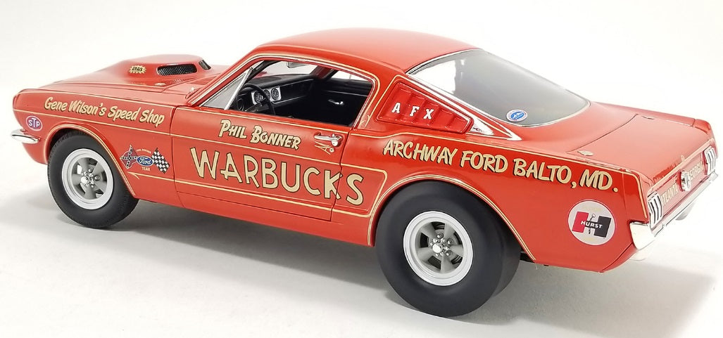 Rear and side view of car with writing on it.