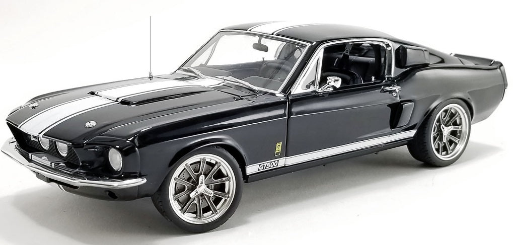 A 1/18 scale model of a 1968 Shelby GT500 Restomod War Horse with a black exterior and white stripes.