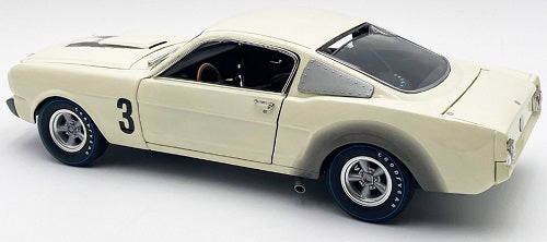 Rear and side view of white car with "3" on the side.