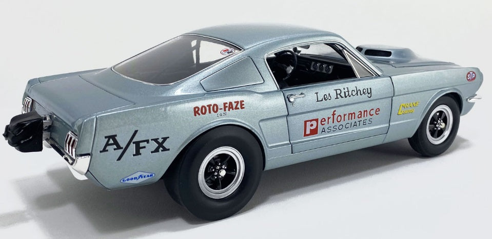 Rear and side view of car with words on the side.