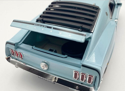 Rear of 1/18 scale model car of 1969 Ford Mustang Mach 1 428 Cobra Jet with open trunk.