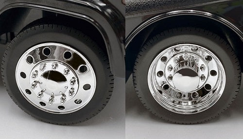 Close up of two chrome wheels with black tires.