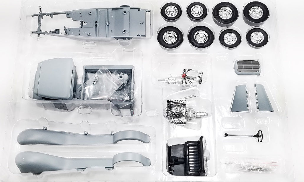 Picture of pieces to build a Hot Rod Pick up truck all separated.