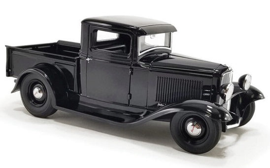 Front Side view of old black truck.