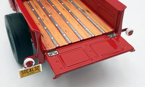 Open tailgate of 1932 Ford truck model.