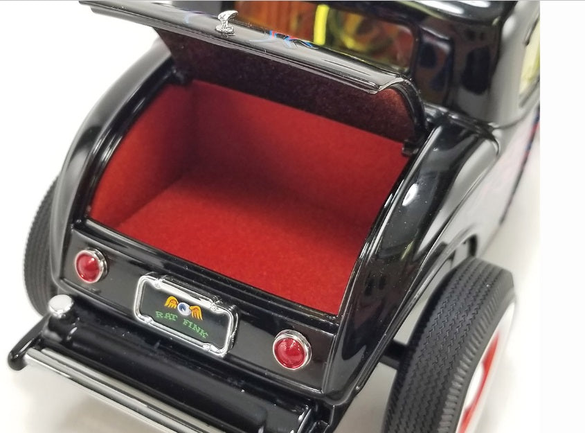 Interior view of the trunk on a diecast model car.