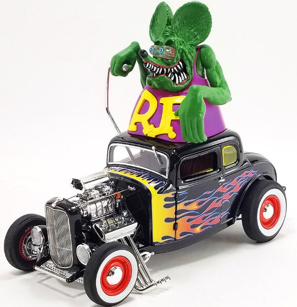 Diecast model car with large "Rat Fink" figure on the roof.