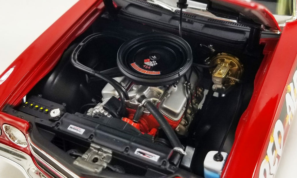 Engine under the hood of a car.