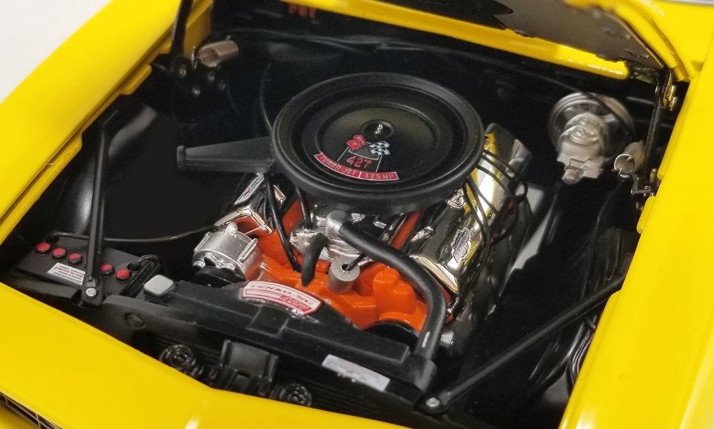View of engine under the hood of a car.