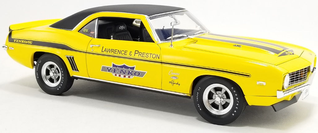 Yellow car with black roof and black stripes.  Has "LAWRENCE & PRESTON" printed on the side.