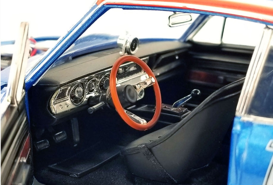 A 1/18 scale diecast model interior of a 1968 Plymouth Barracuda.