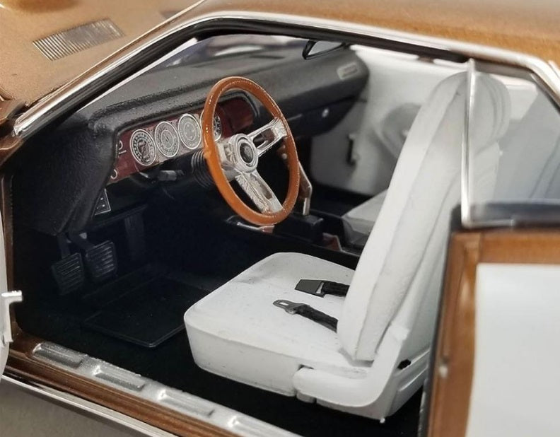 Interior picture of front drivers side, includes drivers seat, stealing wheel, and dashboard.