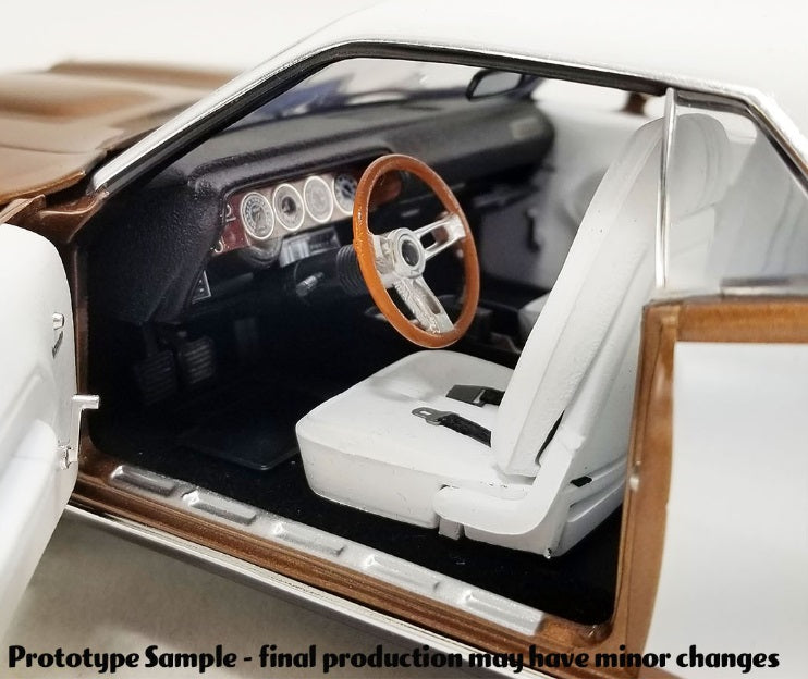 Interior view of front drivers side seat, steering wheel, and dashboard.