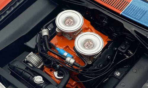 Close up of under the hood of a 1/18 scale model car.