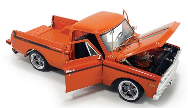 Orange pick up truck with hood, tailgate, and doors open.