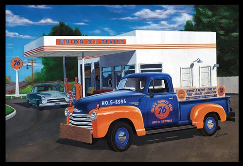 Box art for plastic model kit showing blue and orange 1950's pick up truck in front of a 1950's gas station