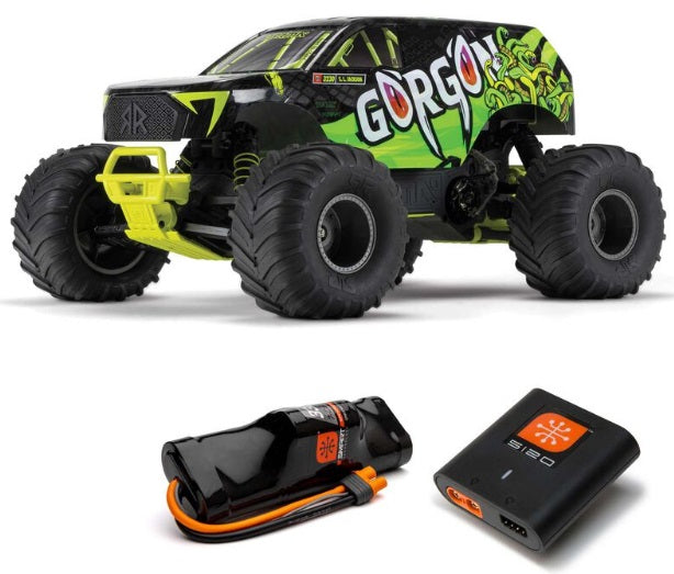 Black and green monster truck with battery and charger.