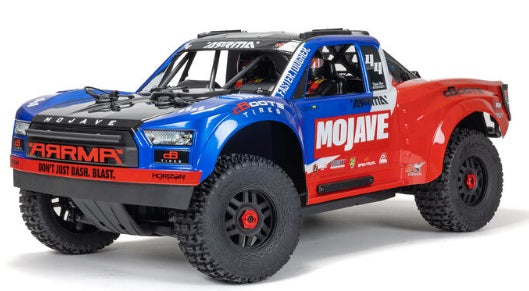 Front and side of Blue and red desert truck.