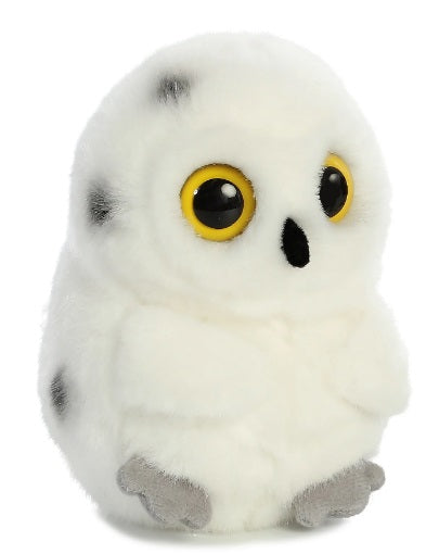 A plush toy owl, white in color with a few spots and yellow eyes.