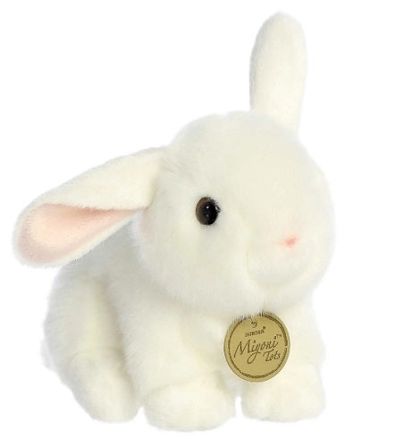 Small white rabbit with one ear standing up.