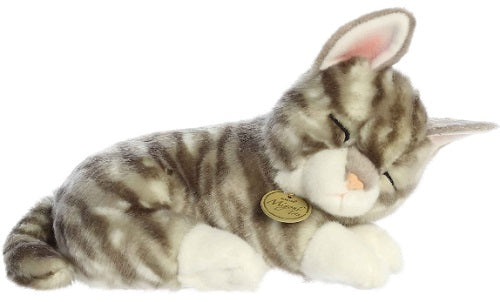 Plush toy of a sleeping gray cat with stripes and white pawsl.