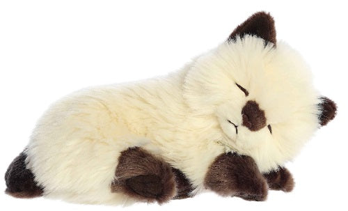 Plush toy of a ligh brown colored sleeping cat with dark brown paws, ears, and tail.