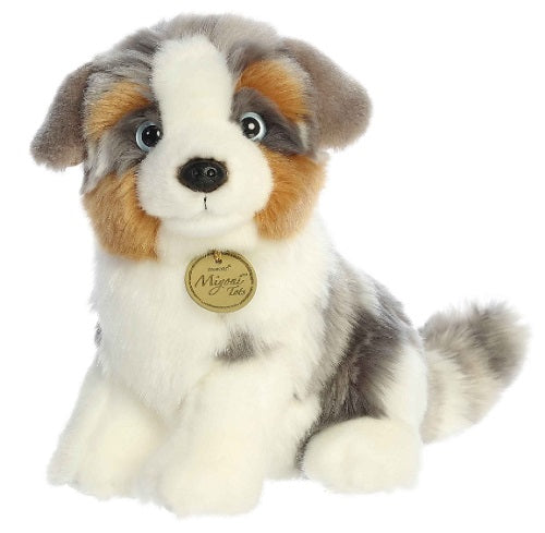 White dog with gray and white features.