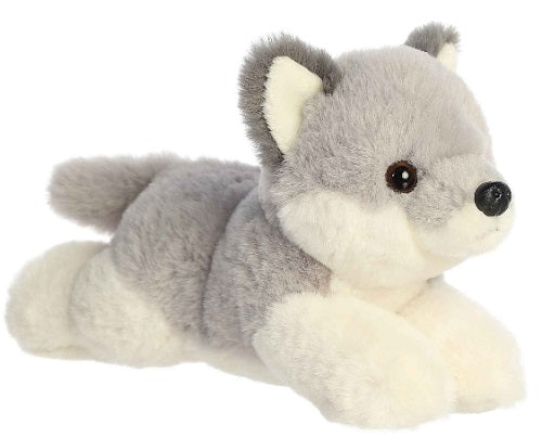 Wolf pup laying down.