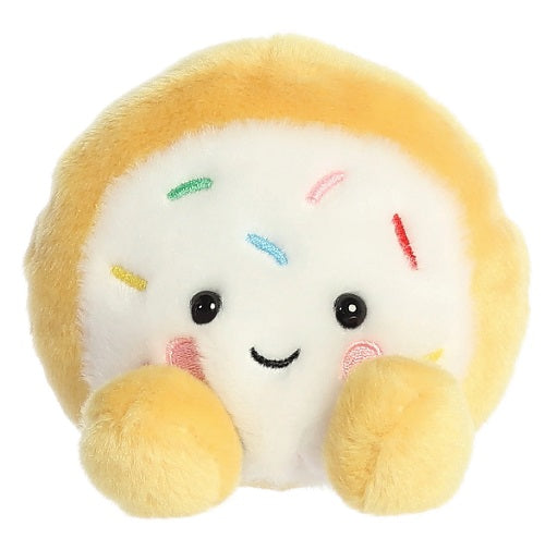 Sugar cookie plush with smiling face and colored embroidered sprinkles.