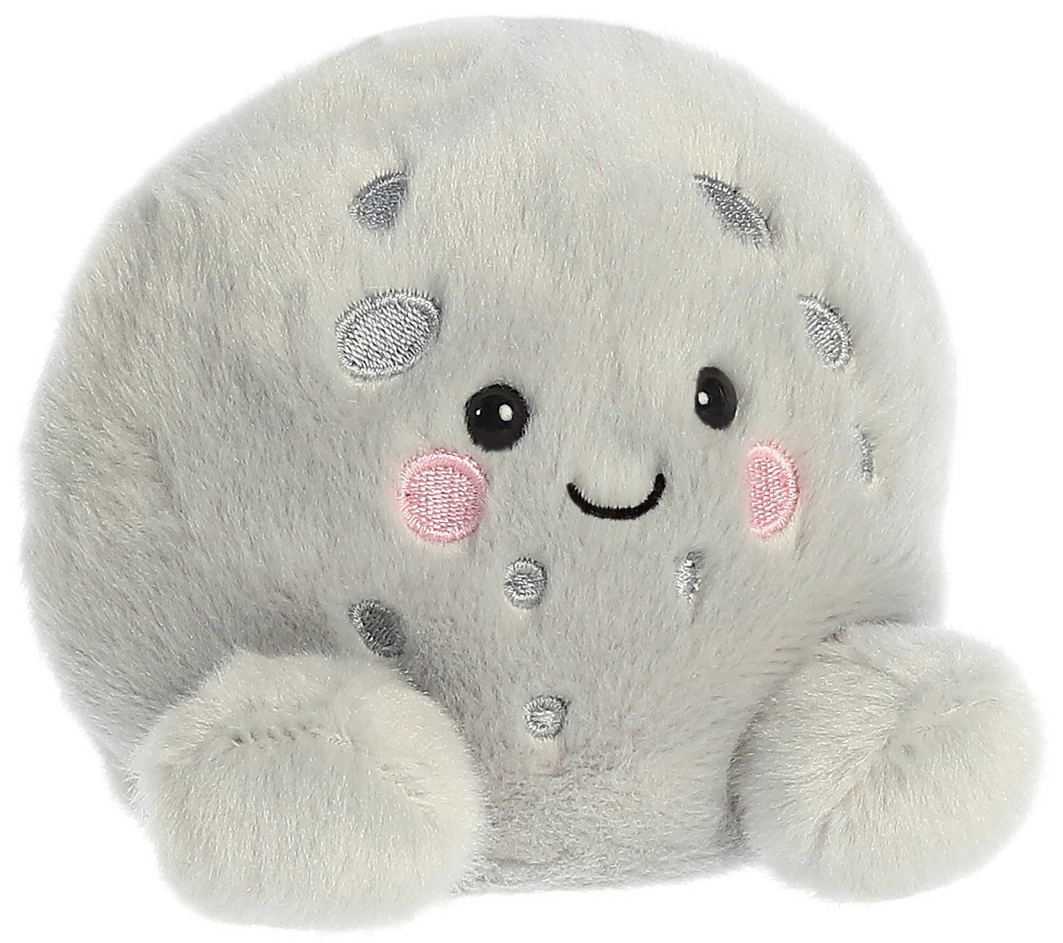 A plush toy resembling a smiling moon.