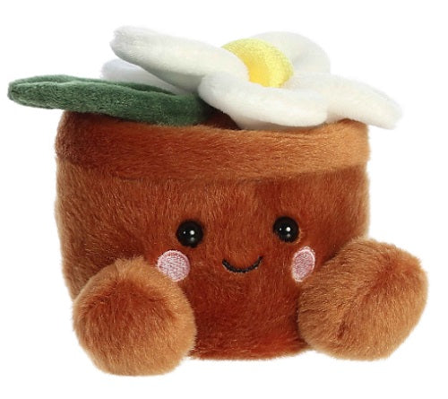 A plush toy resembling a daisy in a pot with a cute smile.