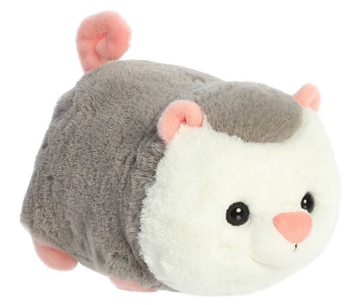 Round possum plush with curly pink tail.