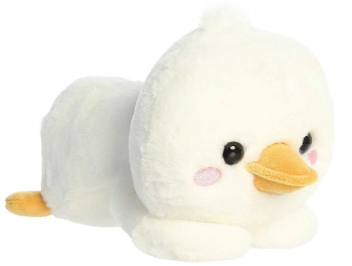 Stuffed duck laying down with oversized head.