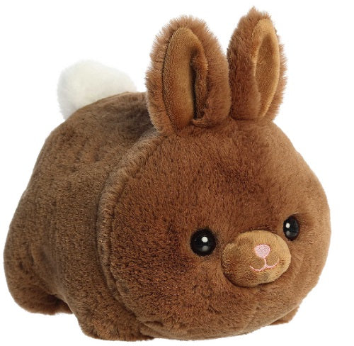 Round plush rabbit with ears standing up and white tail.