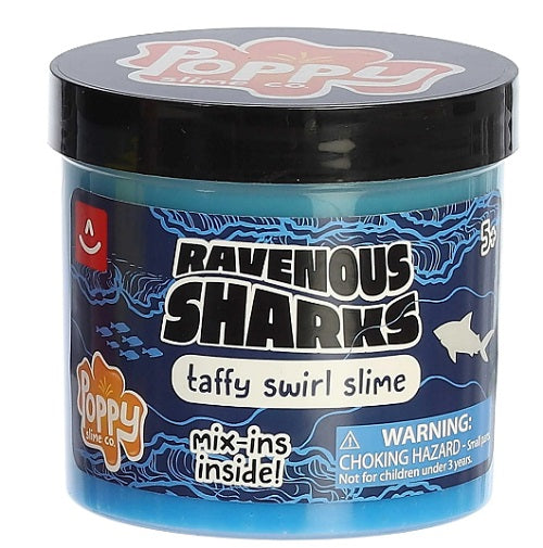 A container of blue slime with shark-themed mix-ins from Poppy Slime Co. labeled as 'Ravenous Sharks taffy swirl slime'.